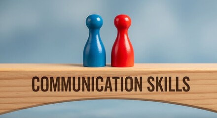 Two game pieces, representing communication, stand on a wooden beam with 'COMMUNICATION SKILLS' printed on it