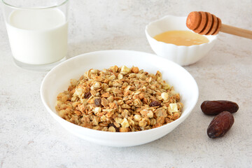 Breakfast with a bowl of muesli, Milk, Honey and Dates