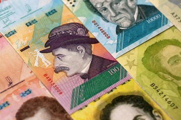 Venezuelan Bolivar currency money bills in big amount. Pile of VED currency banknotes with...