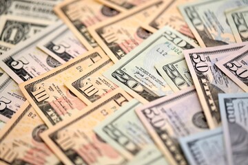 United States Dollar currency money bills. USD currency banknotes in pile with different denomination close up