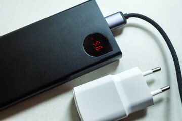 Power bank with display and white European smartphone charger