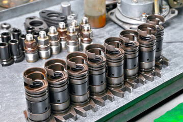 diesel engine fuel pump repair engine parts and components lying on a bench ready for installation