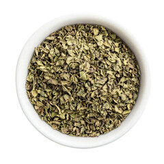 Dried chopped basil in white ceramic bowl Isolated transparent on white background