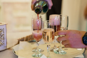Elegant Champagne Pouring at Wedding Reception with Sparkling Bubbles and Rose Gold Drinks in Crystal Flutes