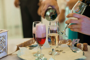 Champagne Pouring at Elegant Event with Flute Glasses Filled with Bubbly Drinks and Foamy Tops