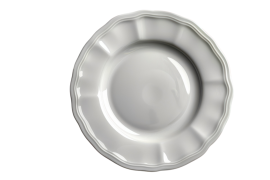 Elegant white ceramic plate with a scalloped edge sits on a stark in a studio setting on transparent background