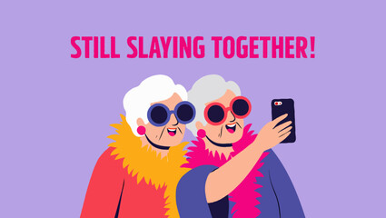 Fototapeta premium Two grandmothers taking a selfie together, still slaying in style and fashion