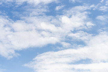 Fototapeta premium soft white clouds across blue sky with wide natural copy space