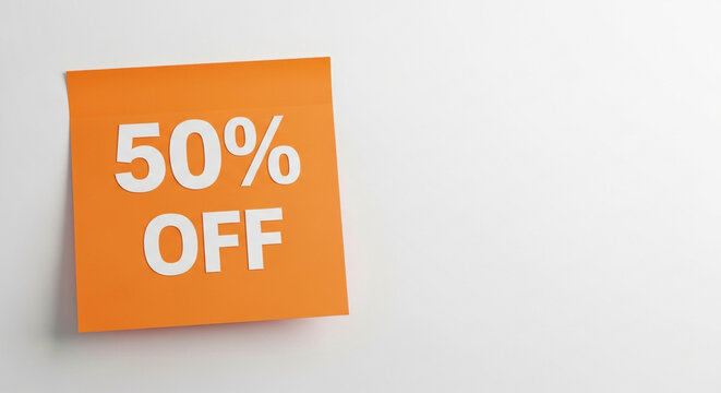 Grab a Stunning 50% Off Deal: Vibrant Sale Announcement on Orange Paper Against White Background