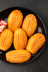 Madeleine cookies sweet dessert traditional french sweets tasty snack fresh delicious gourmet food background on the table rustic top view copy space