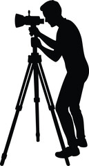 Silhouette of a photographer with a camera on a tripod