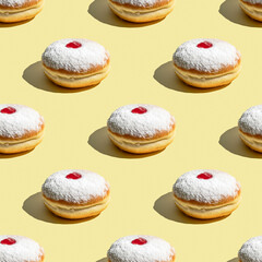 Seamless Pattern of Powdered Sufganiyot with Jam on Yellow Background