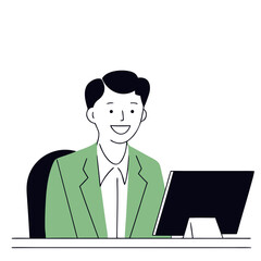 Young man smiling while sitting at a desk with computer screen  