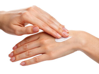 A pair of hands applying cream to another hand, showcasing a skincare routine and emphasizing the importance of hand care.