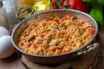 Turkish traditional menemen dish made with eggs, peppers and tomatoes