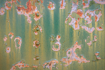Close-up of a rusty painted metal surface