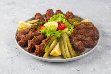 Traditional delicious Turkish food; Turkish name; Cig kofte (raw meatball in Turkish) with lettuce