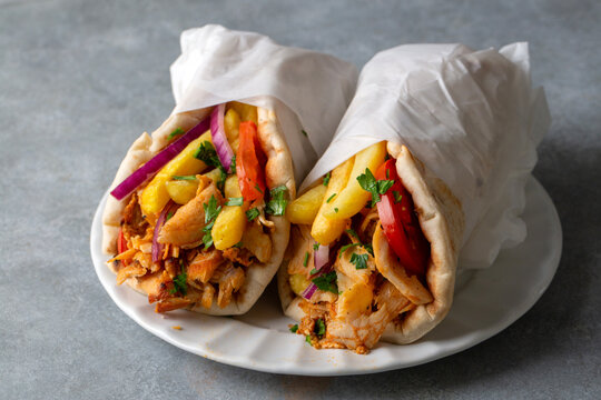 Greek chicken gyros wrapped in pita breads