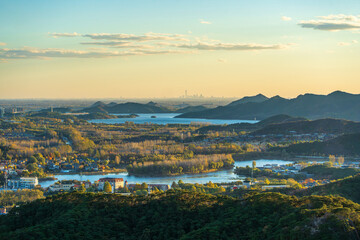 Overlooking Beijing cityscape over Huairou reservoir and mountains