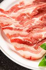 Bacon slice lard with meat slices pieces pork tenderloin portion size natural product tasty snack fresh delicious gourmet food background on the table rustic top view copy space