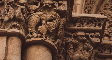 Details of antient medieval architecture with carved stone reliefs.