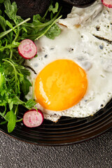 Eggs breakfast black pudding, egg, vegetables, arugula portion size natural product tasty snack fresh delicious gourmet food background on the table rustic top view copy space