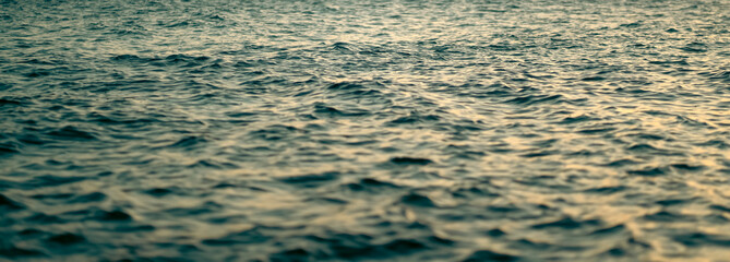 A water surface with small waves, a beautiful ocean closeup.