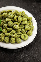 Gnocchi spinach potato dough second course portion size natural product tasty snack fresh delicious gourmet food background on the table rustic top view copy space