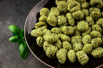 Gnocchi spinach potato dough second course portion size natural product tasty snack fresh delicious gourmet food background on the table rustic top view copy space
