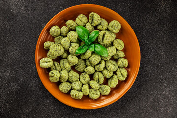 Gnocchi spinach potato dough second course portion size natural product tasty snack fresh delicious gourmet food background on the table rustic top view copy space