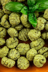 Fototapeta premium Gnocchi spinach potato dough second course portion size natural product tasty snack fresh delicious gourmet food background on the table rustic top view copy space