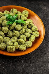 Gnocchi spinach potato dough second course portion size natural product tasty snack fresh delicious gourmet food background on the table rustic top view copy space