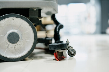 worker is cleaning floor with machine