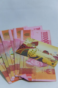 Indonesian Rupiah Money and Payment Card on White Background &mdash; Finance and Economy Concept