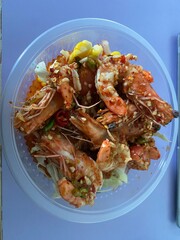 Thai style fried shrimp with rice in a bowl