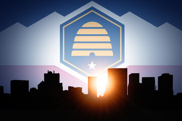 Sunset over Salt Lake City Skyline with Utah State Flag in the Sky