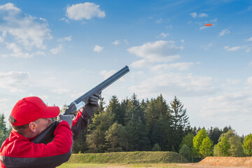 man clay pigeon shooting © Alex