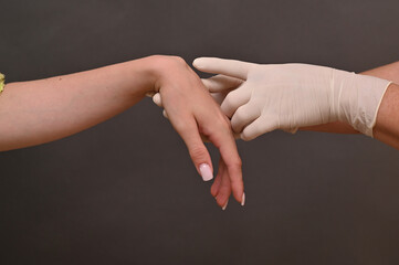 fluid filled ganglion around wrist joint. cyst on arm requires attention. concept of hygroma treatment and examination. Wrist ganglion cyst appears as soft swelling on joint. on grey background