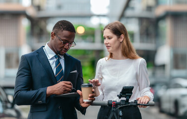 Two Professionals Commuting to Work by Sustainable Urban Transport