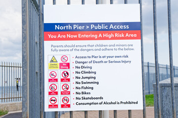 Safety sign at beach area near the sea in Aberdeen