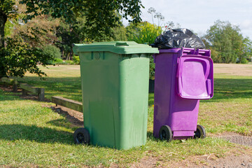 Wheelie bins in row for refuge collection outdoors