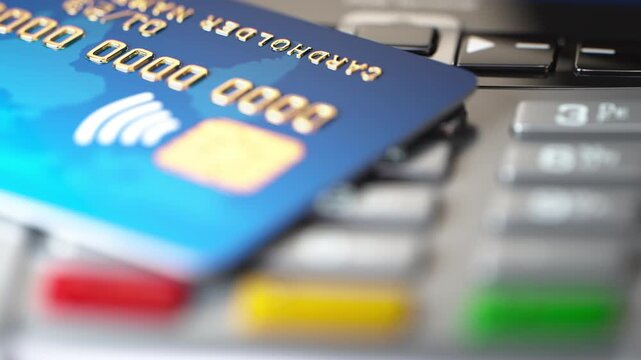 Credit card on POS terminal. Video animation with variable depth of field DOF effect.