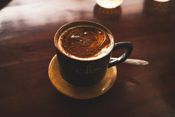 Vietnamese coffee, artisanal cups, wood background