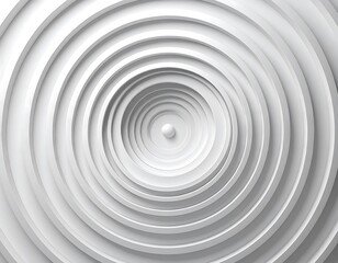 An abstract aerial perspective of concentric, radiating white circles with a small ball