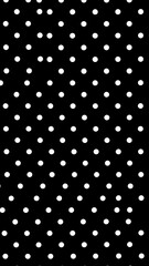 An abstract dark background with a pattern of white circular dots across its surface