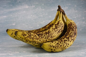 Photo of five browning fairtrade bananas.