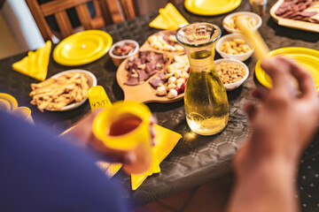 Friends gathering for dinner enjoying appetizers and drinks