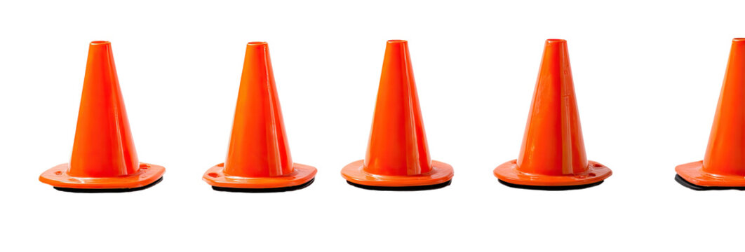 Five bright orange, traffic safety cones lined up, standing isolated against a black background - Powered by Adobe