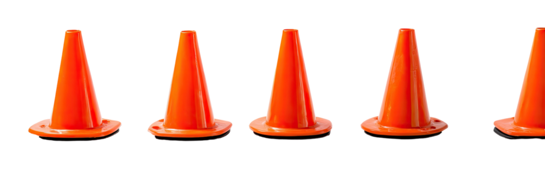 Five bright orange, traffic safety cones lined up, standing isolated against a black background