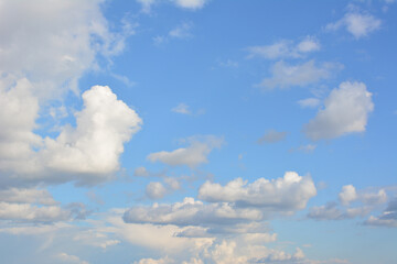 Bright Blue Sky with Fluffy White Cumulus Clouds